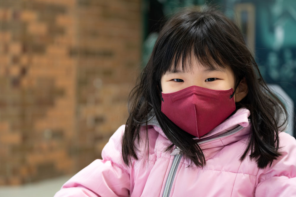 picture of a cute girl wearing a face mask