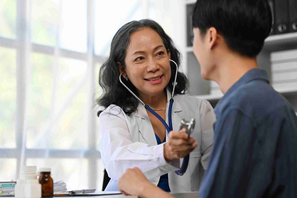 mature female patient with examining a young patient