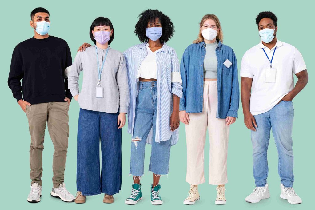 people with face medical masks looking at the camera