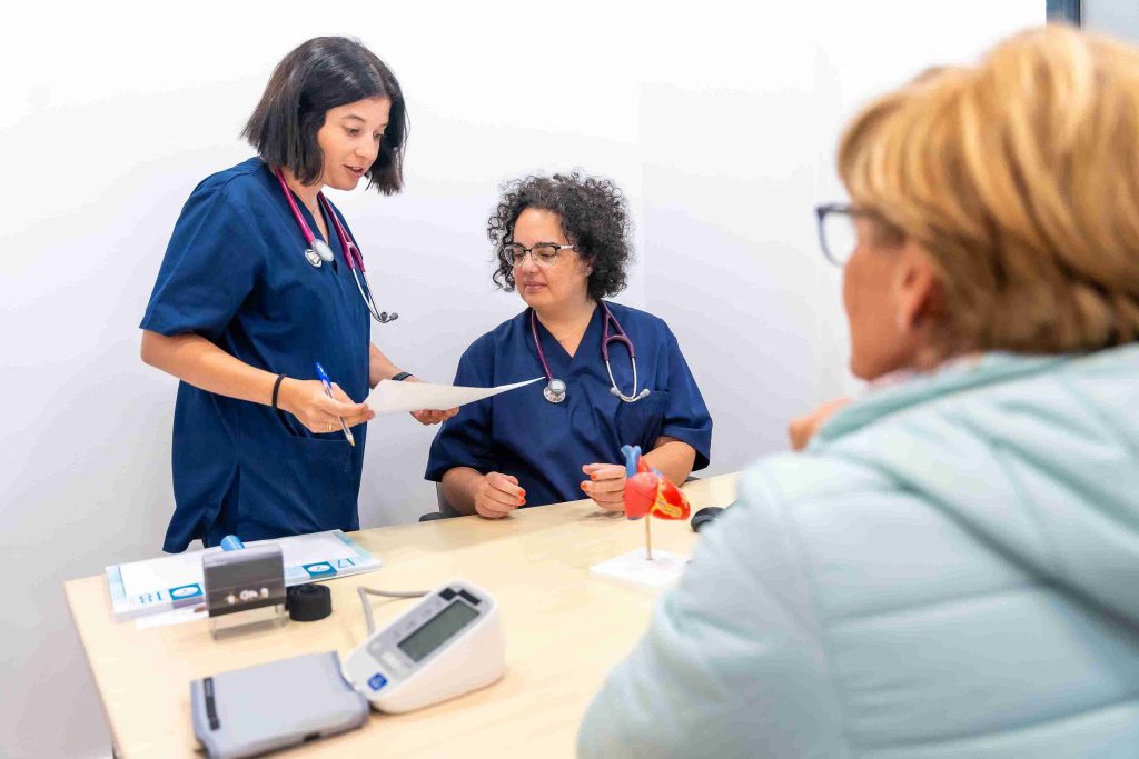 nurse and doctor looking at paperwork