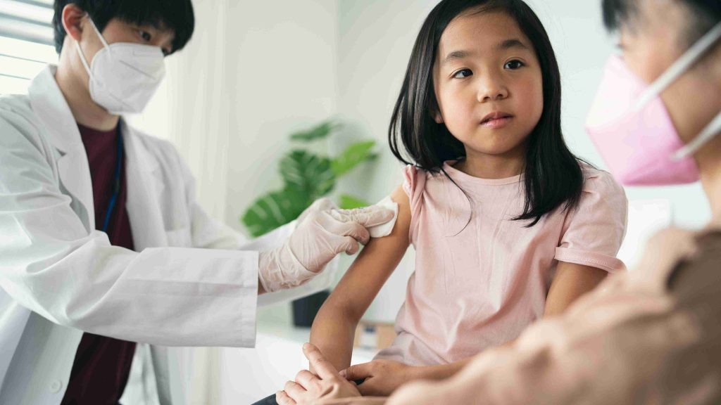 Young girl getting vaccinated.