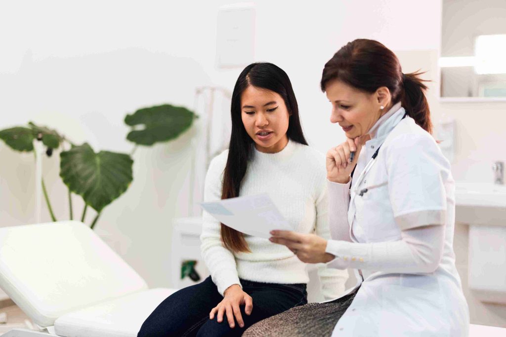 Medical doctor explaining something to a patient.